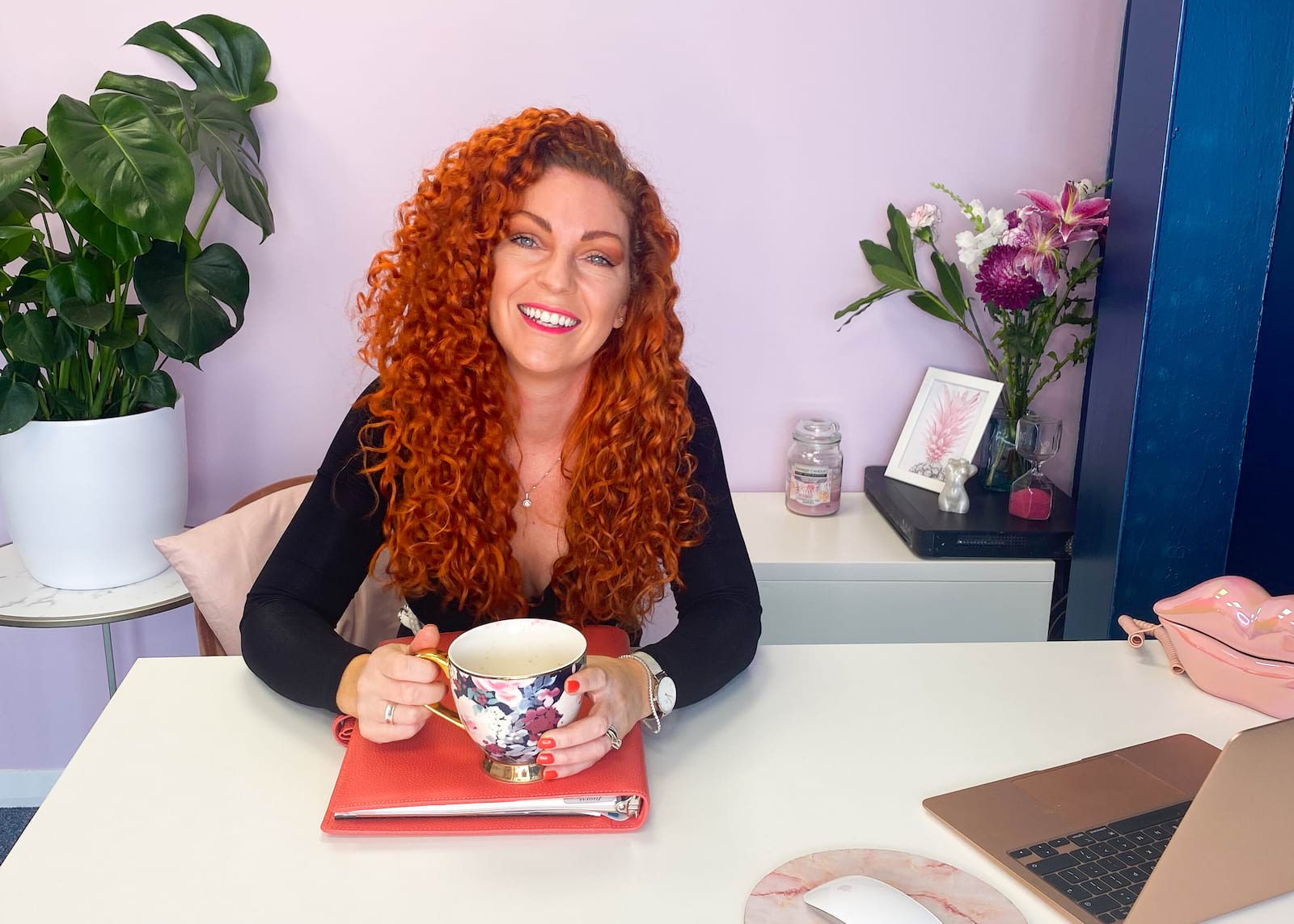 Heather Kennett at her home office with a cup of tea